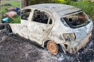 Corpos estavam cados prximo a um veculo carbonizado